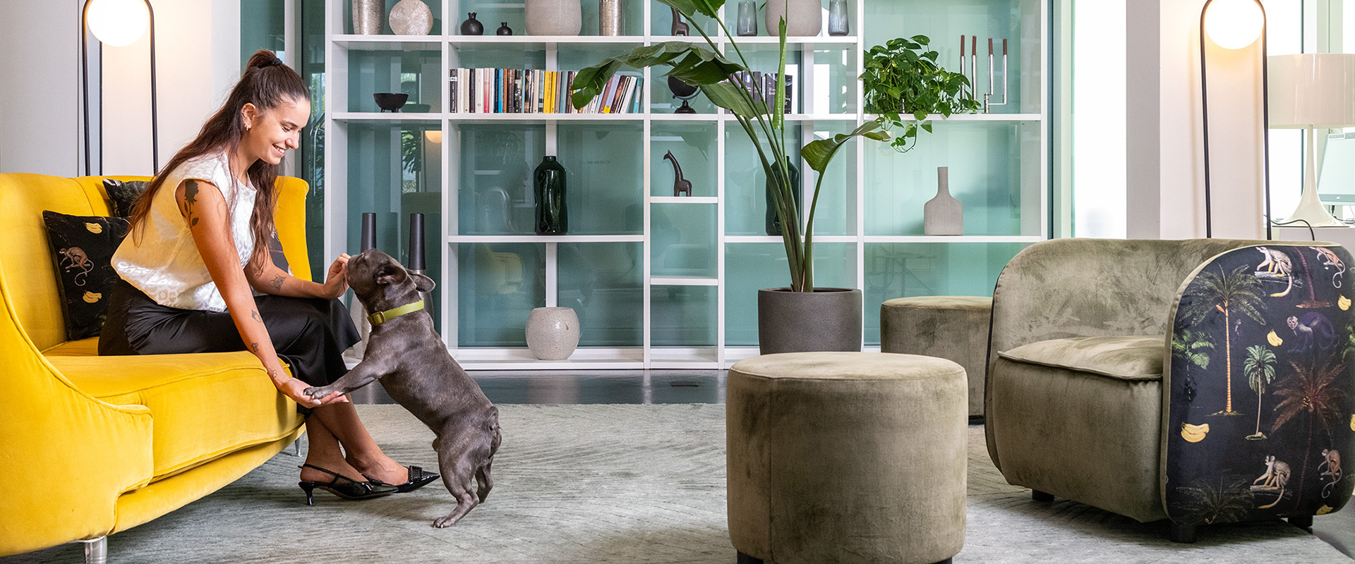 Cozy corners of the hall with green armchairs and yellow sofa